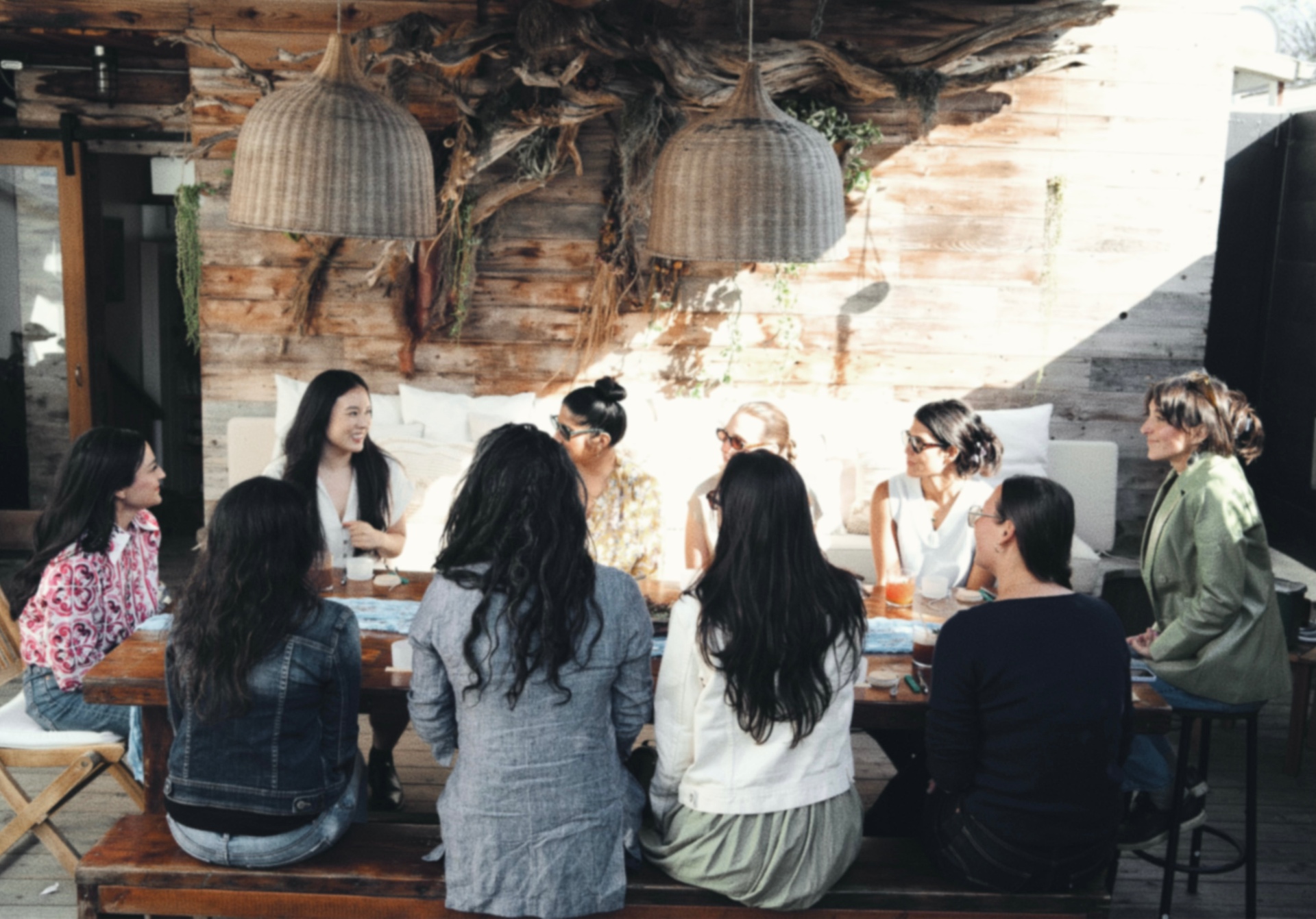 Women gathered around a wooden table