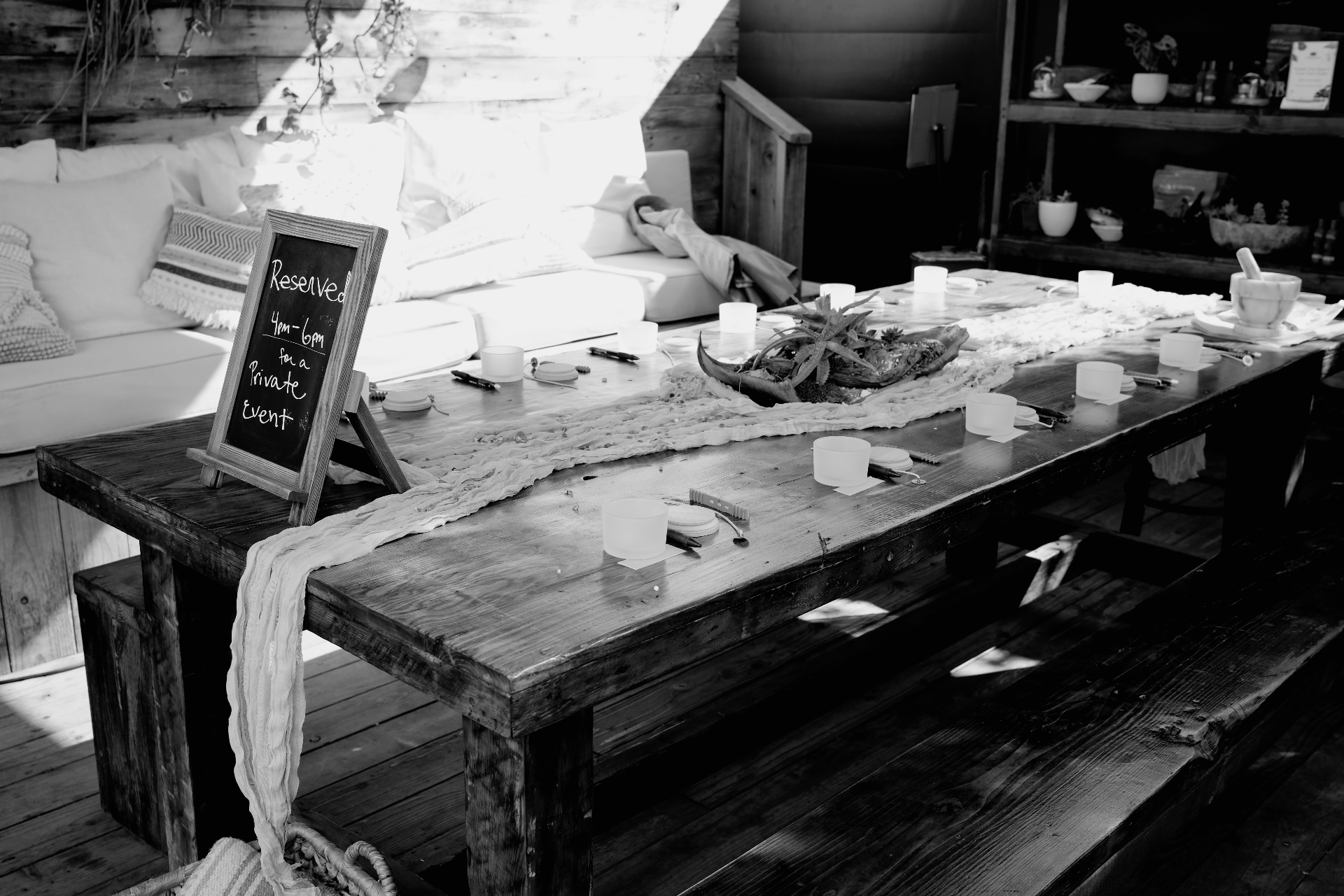 Long wooden table set for a private gathering